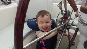 Baby Orion's first time at the helm. We haven't left the dock yet, but he doesn't know this. 